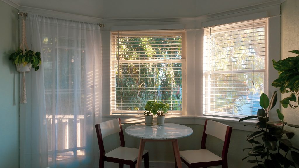 sun rays coming in through the window with blinds