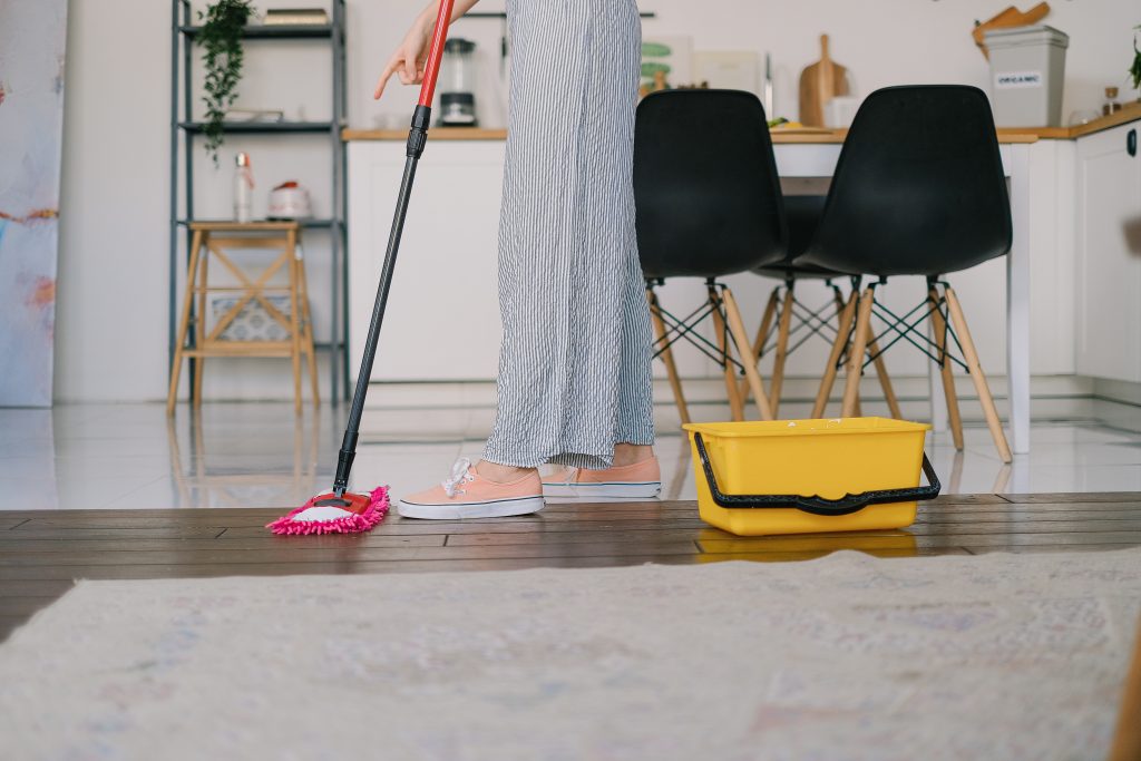 lady mopping wooden floor