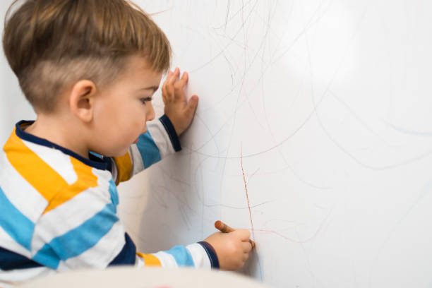 kid marking flat paint walls